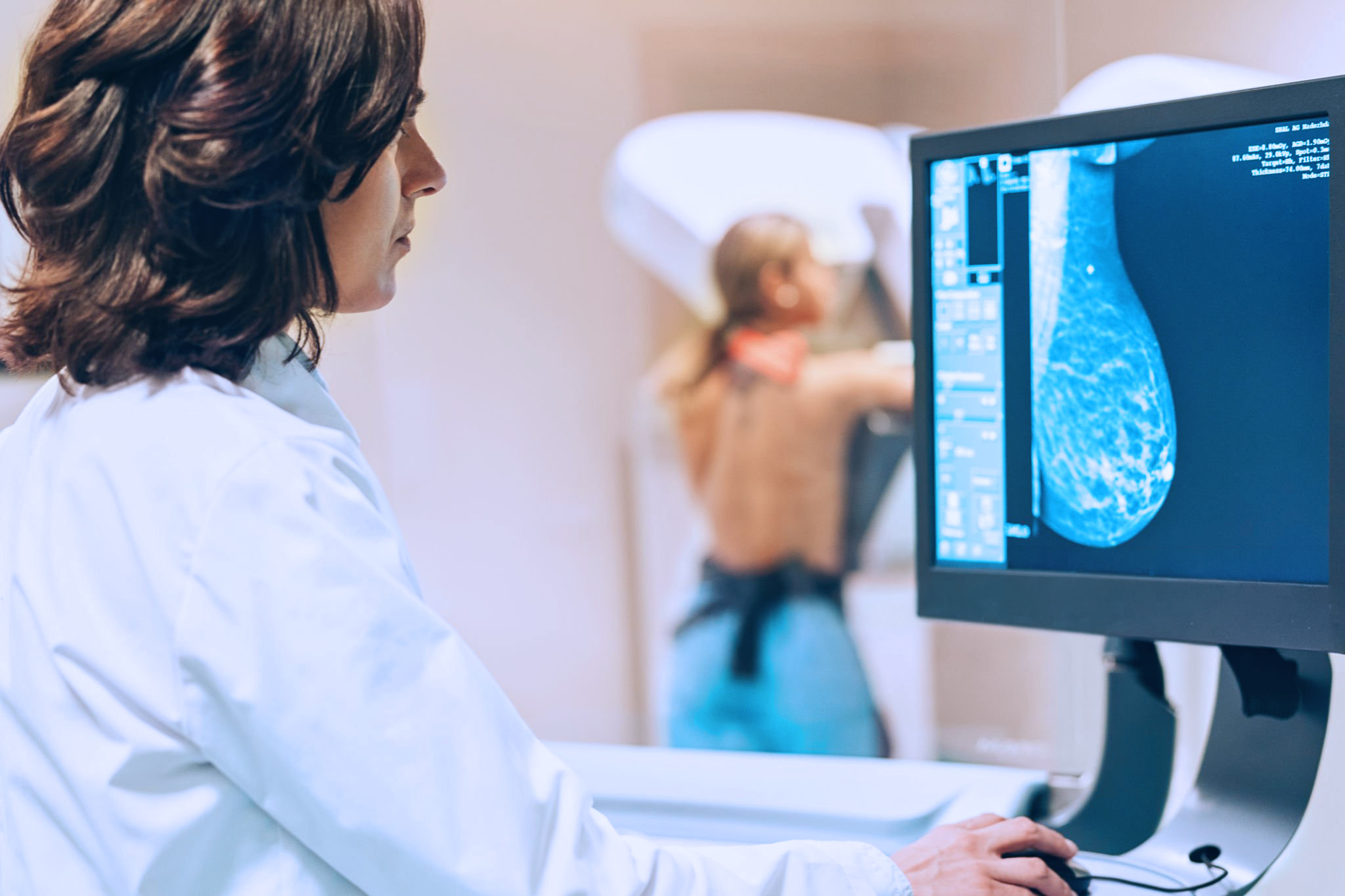 Doctor and patient making a mammography