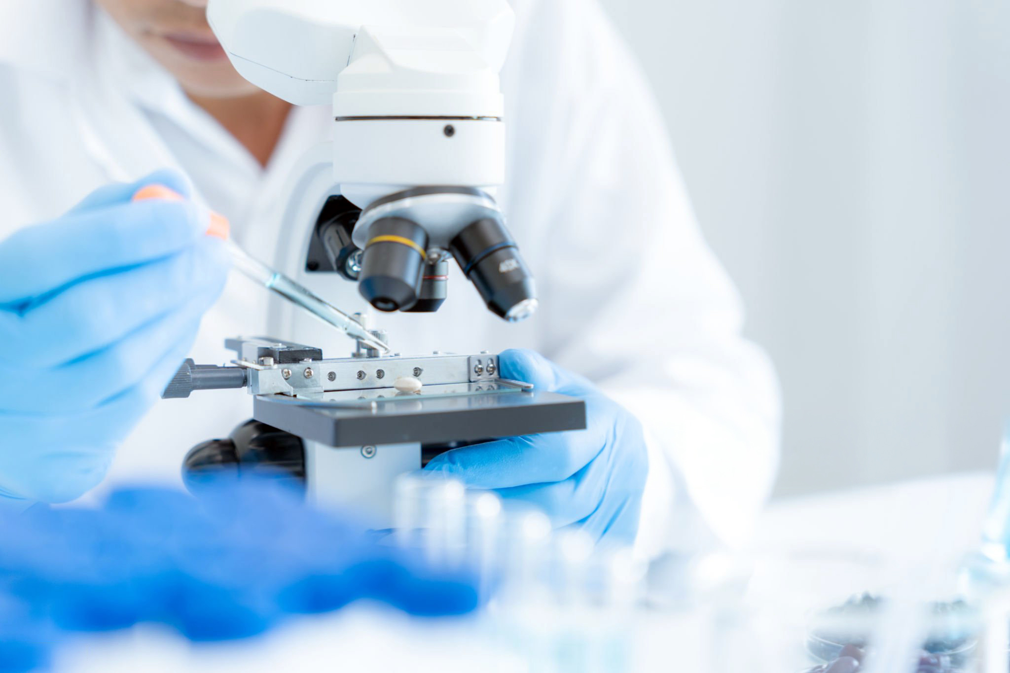 Scientist analyze biochemical samples in advanced scientific laboratory. Medical professional use microscope look microbiological developmental of viral. Biotechnology research in science lab.